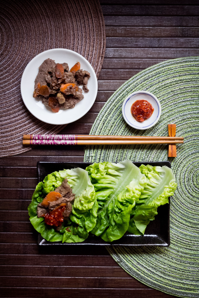 ssam (lettuce with meat and sauce) and chopsticks