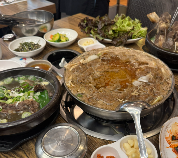 bulgogi marinated beef cooked and served with rice and side dishes