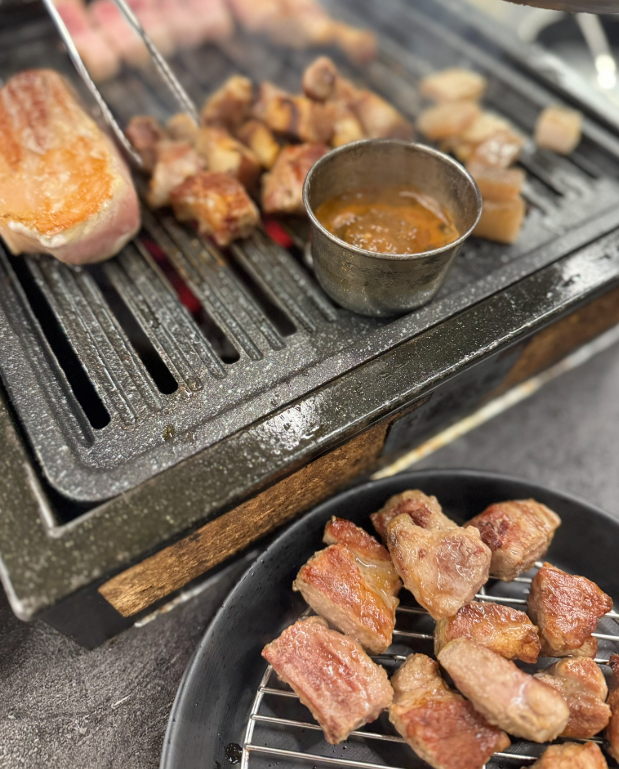 samgyeopsal grilled pork belly cooked at the table in korea
